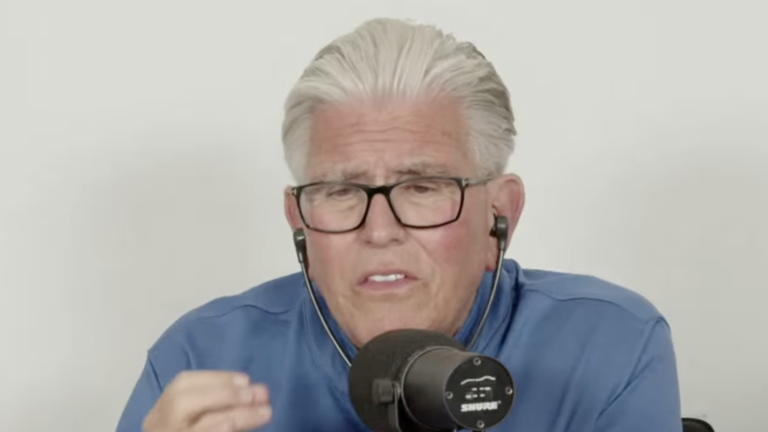 Mike Francesa in a blue shirt speaking into a microphone during his Yankees–Rays Game 2 postgame podcast.