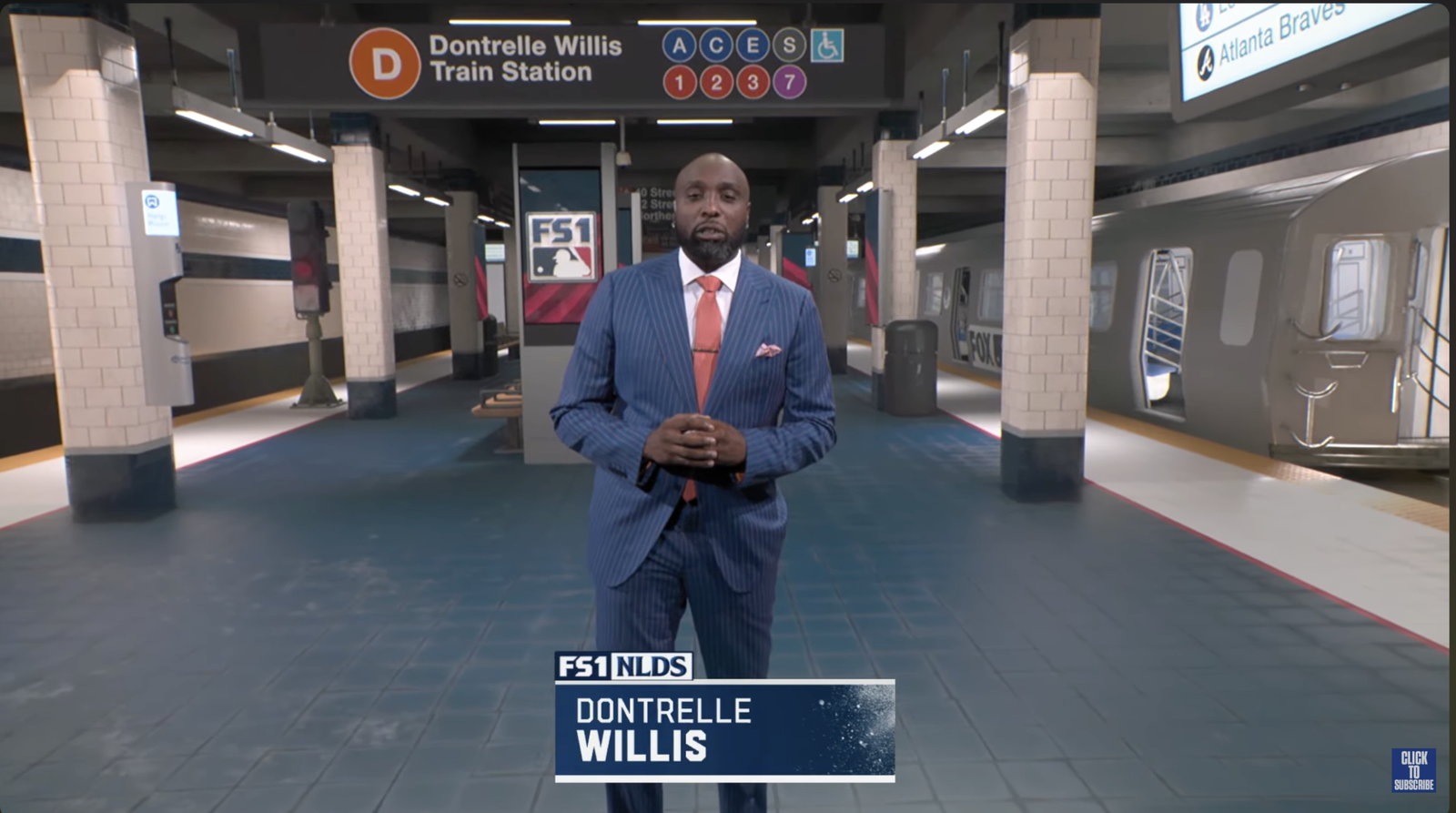 Dontrelle Willis in a blue pinstripe suit during FOX’s virtual Train Station postgame segment.