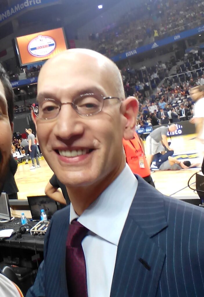 Adam Silver in glasses and a suit at an arena in Madrid in October 2016.