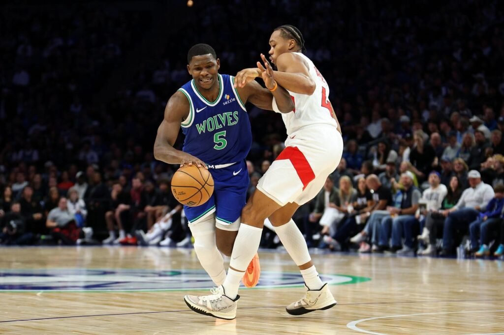 Anthony Edwards dribbles against Toronto’s Scottie Barnes at Target Center on October 25, 2026.