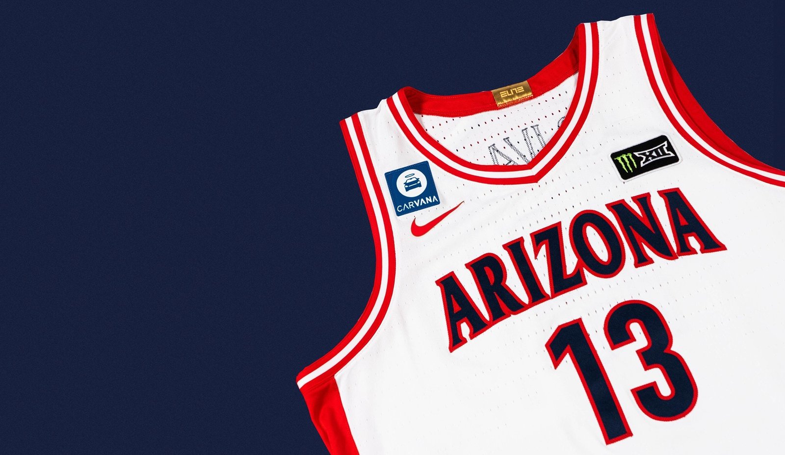 Carvana patch on a white Arizona Wildcats basketball jersey.