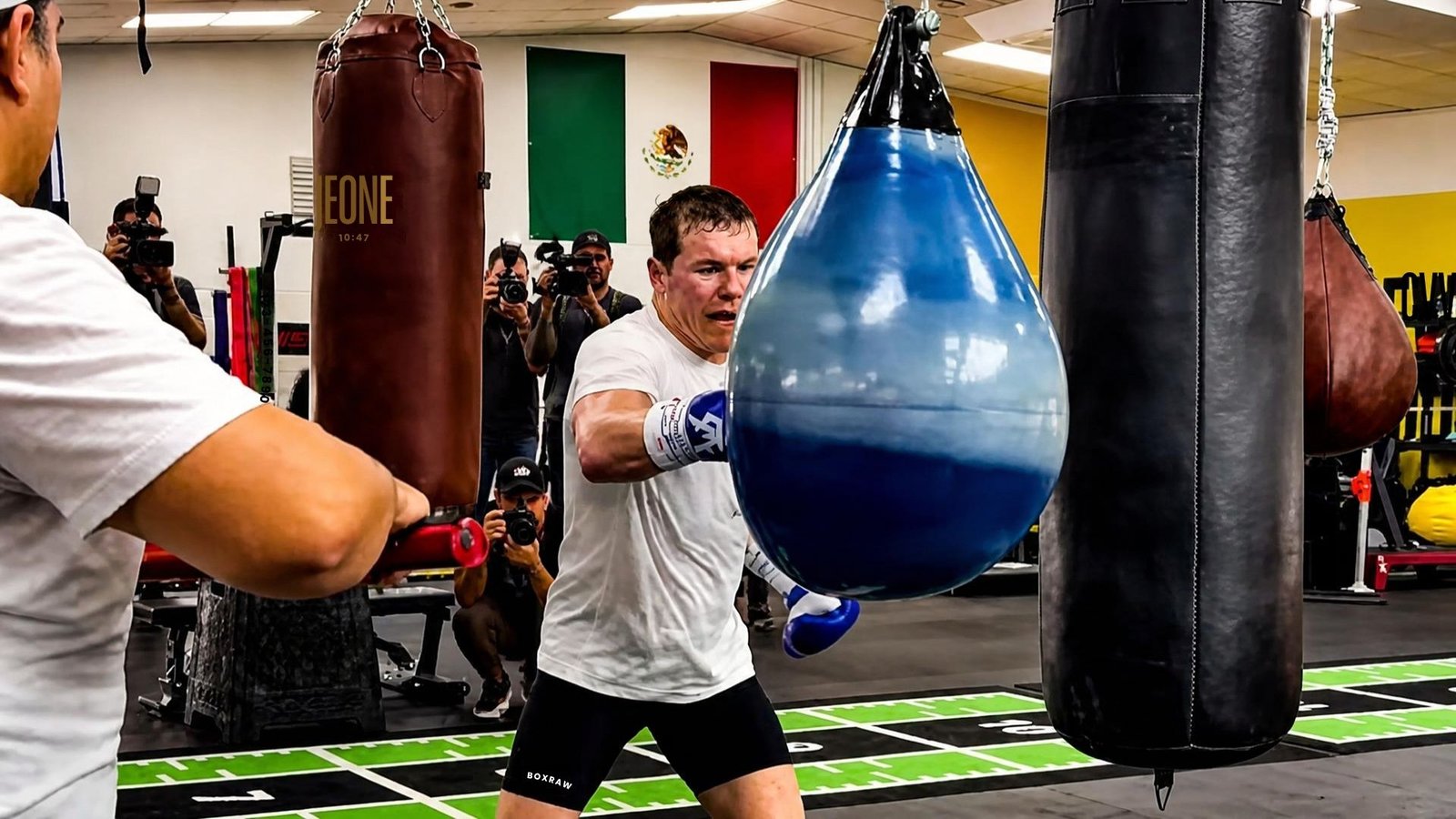 Canelo Alvarez punches a blue water bag during training in Valencia ahead of the Mbilli fight.
