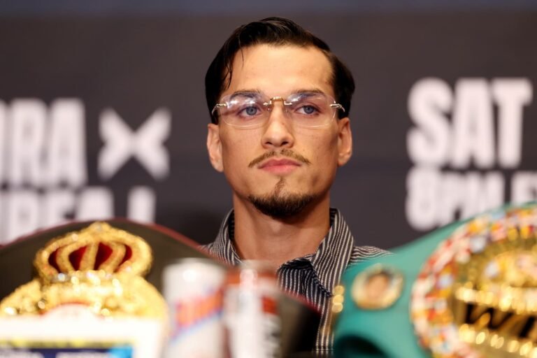 Brandon Figueroa sits behind championship belts at the October 15 press conference in Las Vegas.