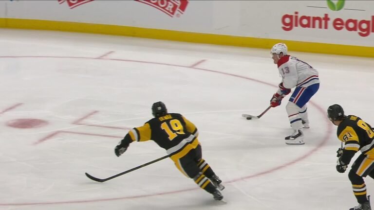 Cole Caufield controls the puck between Penguins players during Montreal’s game in Pittsburgh on October 3, 2026.