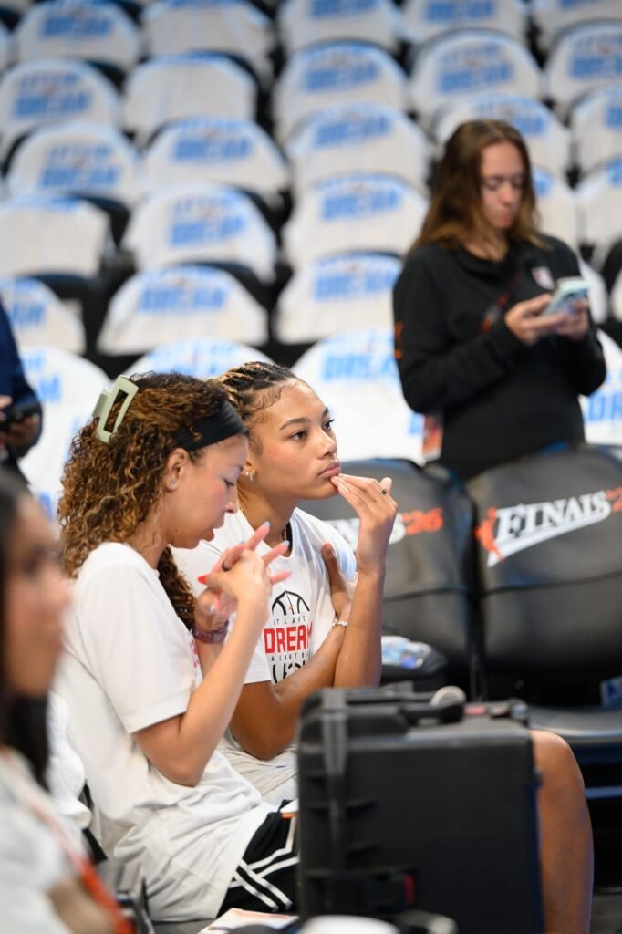 Dream assistant coach Chelsea Lyles talks with Naz Hillmon before Game 4 at State Farm Arena.
