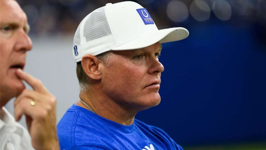 Chris Ballard wearing a white Indianapolis Colts cap and blue team shirt.