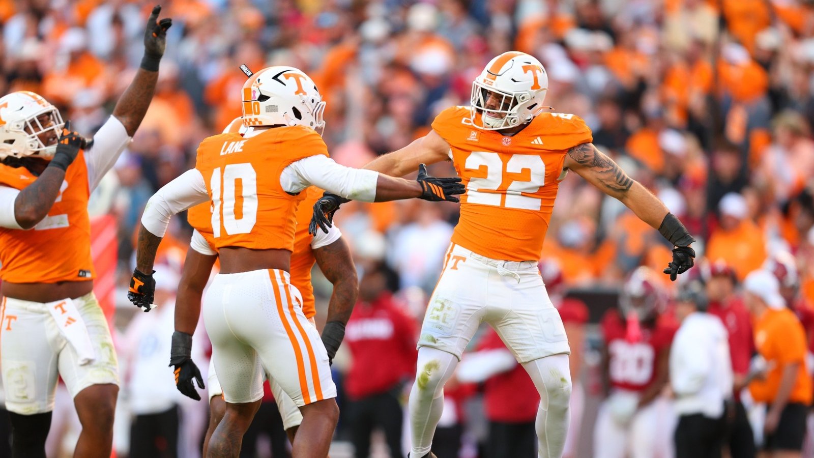 Tennessee defenders celebrate together during the Alabama game at Neyland Stadium.
