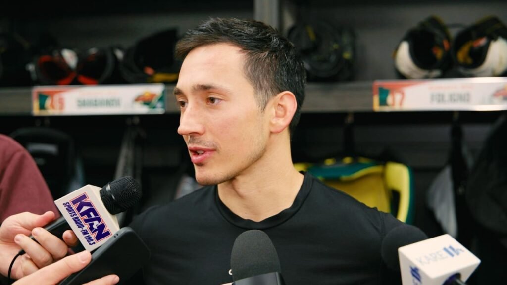 Jared Spurgeon speaks to reporters in the Wild locker room after the October 3, 2026 game against Boston.