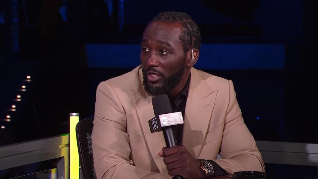 Terence Crawford holding a TNT Sports and DAZN microphone during The Fight postfight discussion.