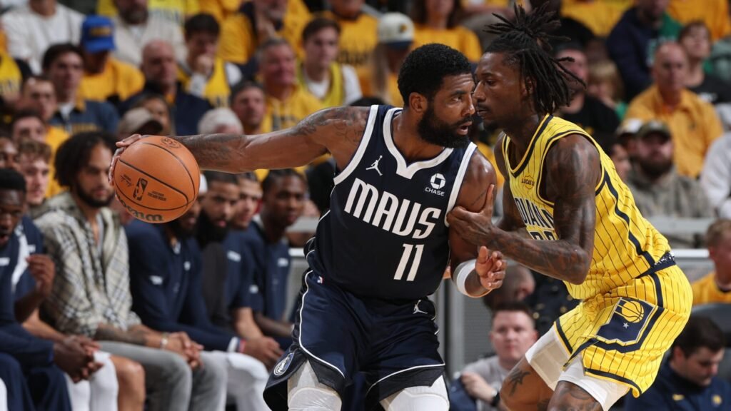 Kyrie Irving protects the ball against Indiana during Dallas’s October 23 game at Gainbridge Fieldhouse.