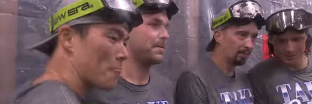 Dodgers players wearing celebration goggles in the clubhouse after NLDS Game 4 on October 7, 2026.
