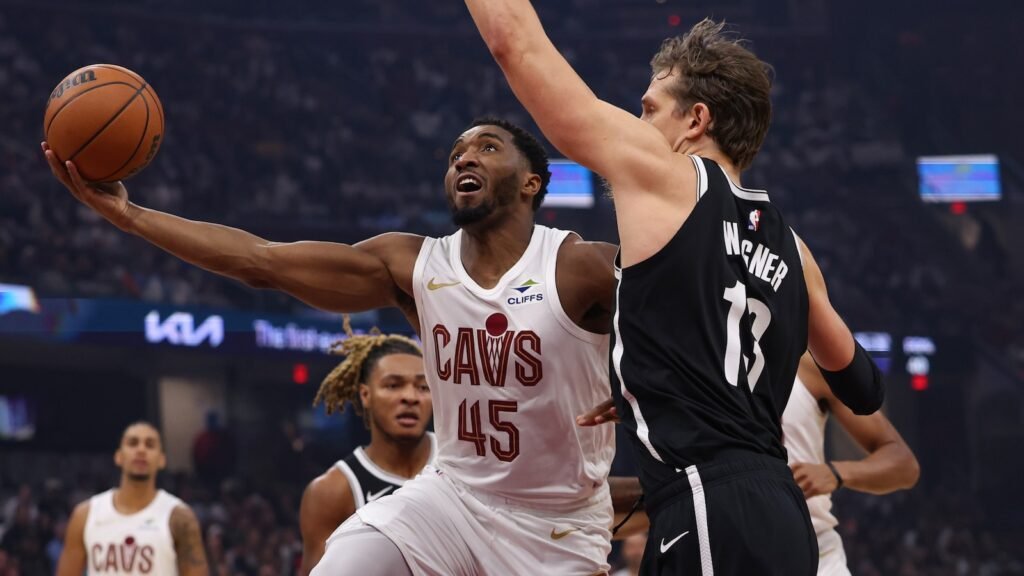 Cleveland’s Donovan Mitchell shoots over Brooklyn’s Moritz Wagner on October 24, 2026.
