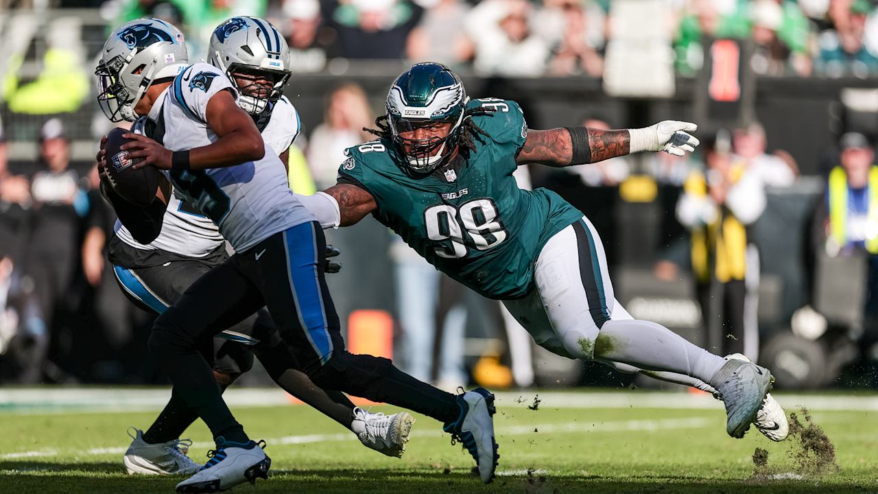 Eagles defensive tackle Jalen Carter reaches toward the Carolina quarterback during the October 18, 2026 game.