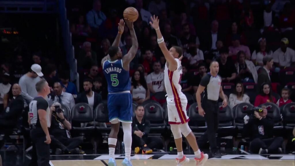 Anthony Edwards shoots a three-pointer over a Miami defender at Kaseya Center.