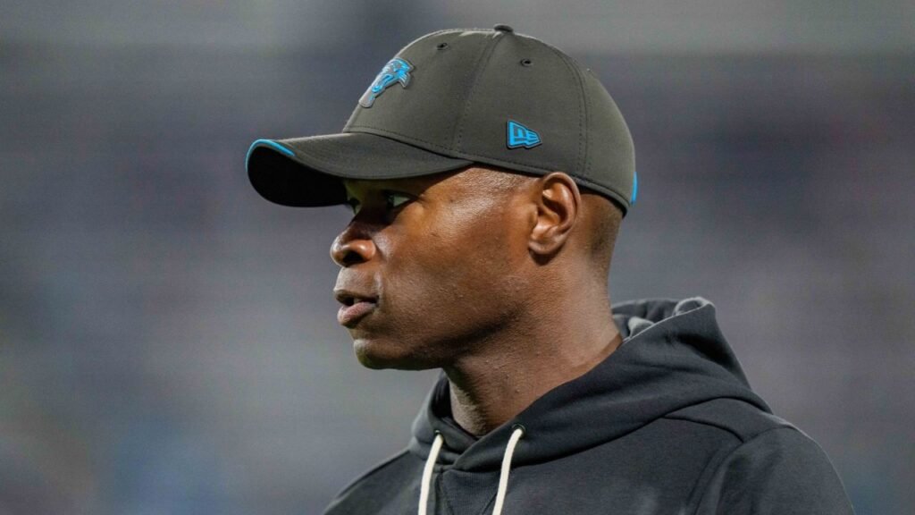 Ejiro Evero wearing a Panthers cap and black hoodie during Carolina’s October 4, 2026 game