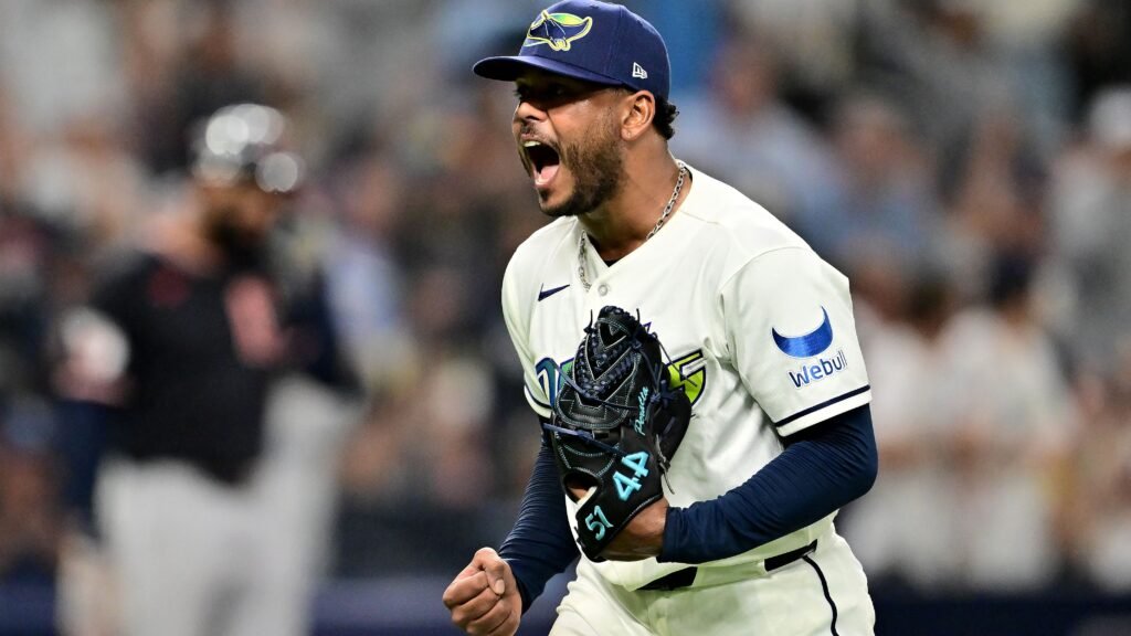 Freddy Peralta celebrates on the mound in a Tampa Bay Rays uniform.