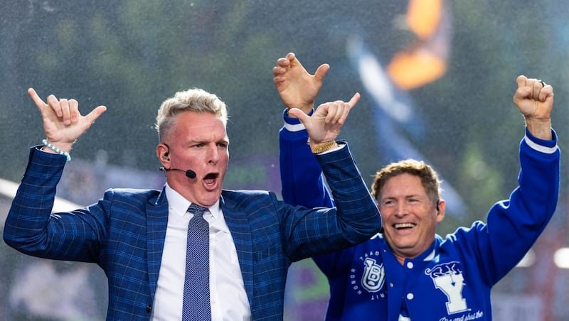 Pat McAfee, left, and Steve Young celebrate on College GameDay at BYU’s campus in Provo on October 17, 2026.