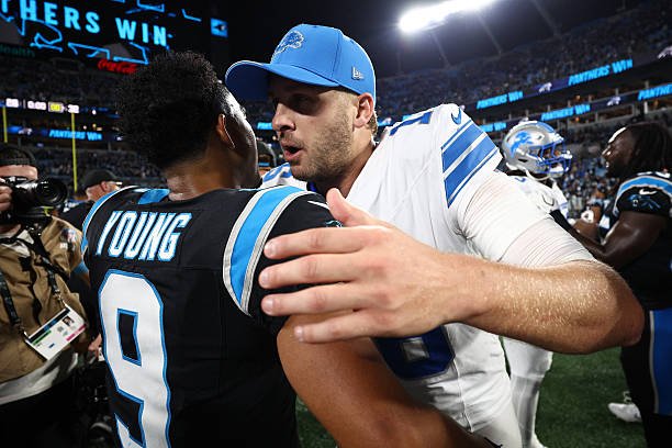 OCTOBER 04: Bryce Young #9 of the Carolina Panthers and Jared Goff #16 of the Detroit Lions meet after the game at Bank of America Stadium