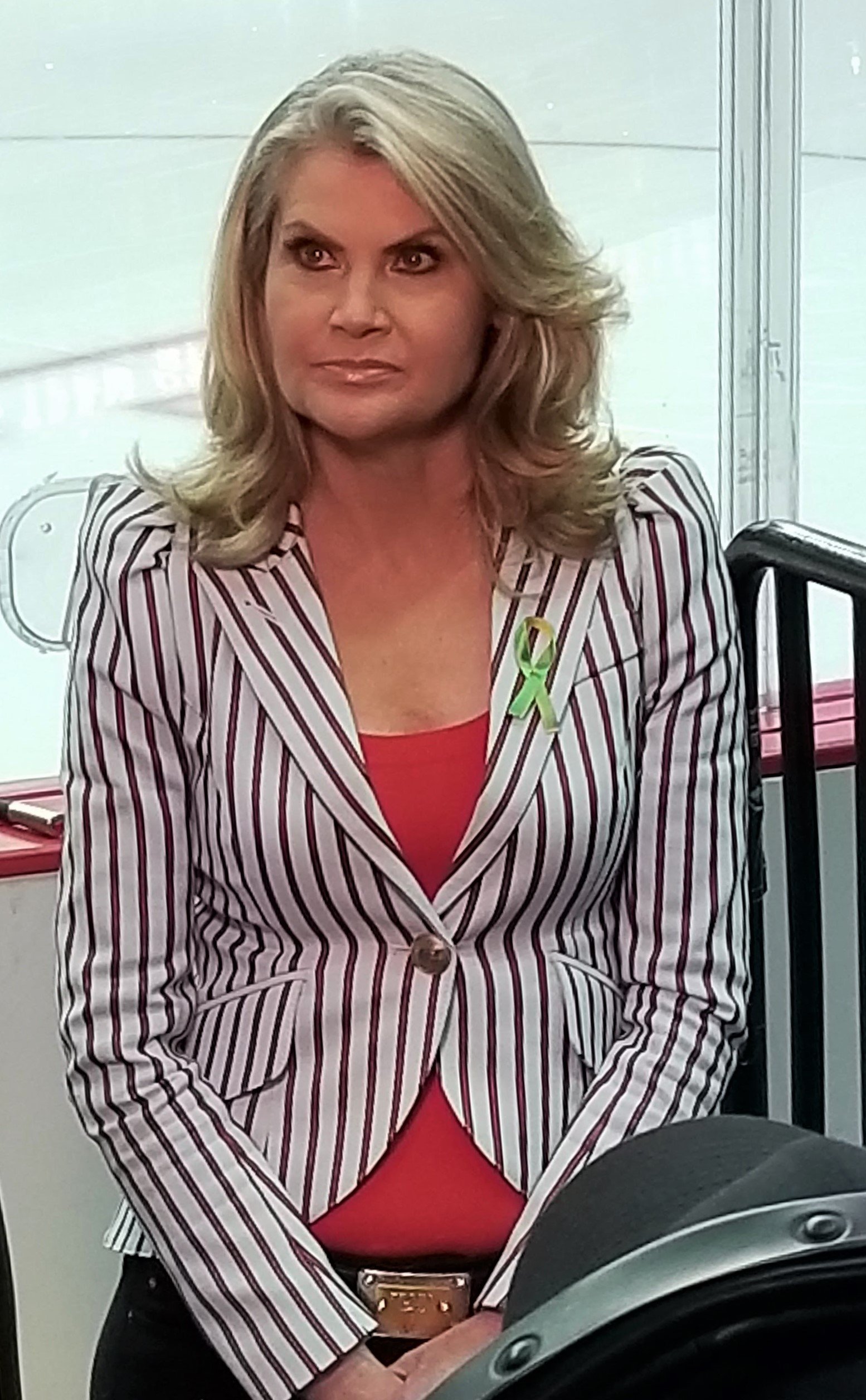 Christine Simpson standing beside the boards at Capital One Arena in 2018.