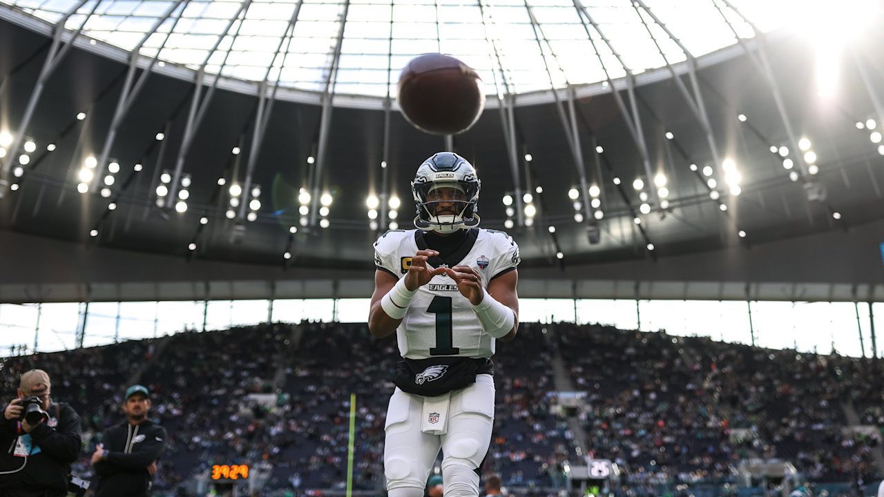 Jalen Hurts tosses a football at Tottenham Hotspur Stadium in London on October 11, 2026.