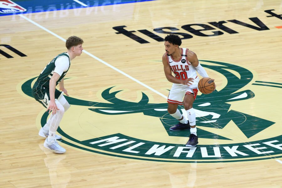 Kasparas Jakučionis defends Chicago’s Tre Jones at midcourt in Milwaukee on October 23, 2026.