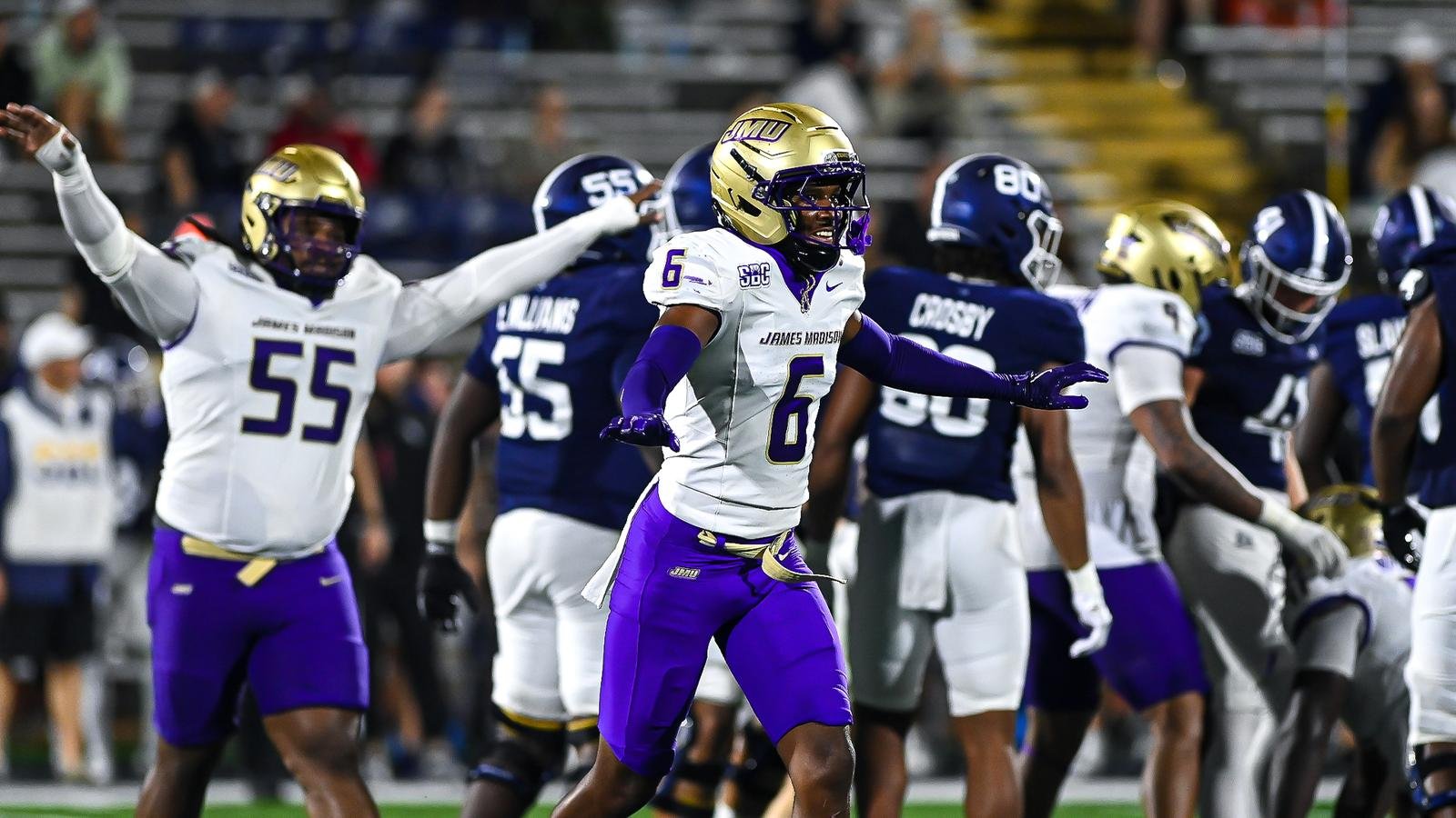 DJ Kelly and James Madison teammates celebrate a defensive stop against Georgia Southern.