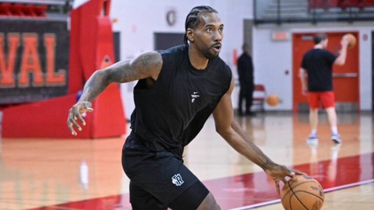 Kawhi Leonard handles a basketball during Raptors training camp in Quebec City.