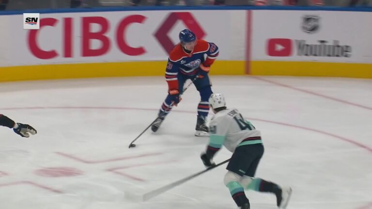 Owen Michaels handles the puck for Edmonton as Seattle’s Ryker Evans defends during their October 3, 2026 game.