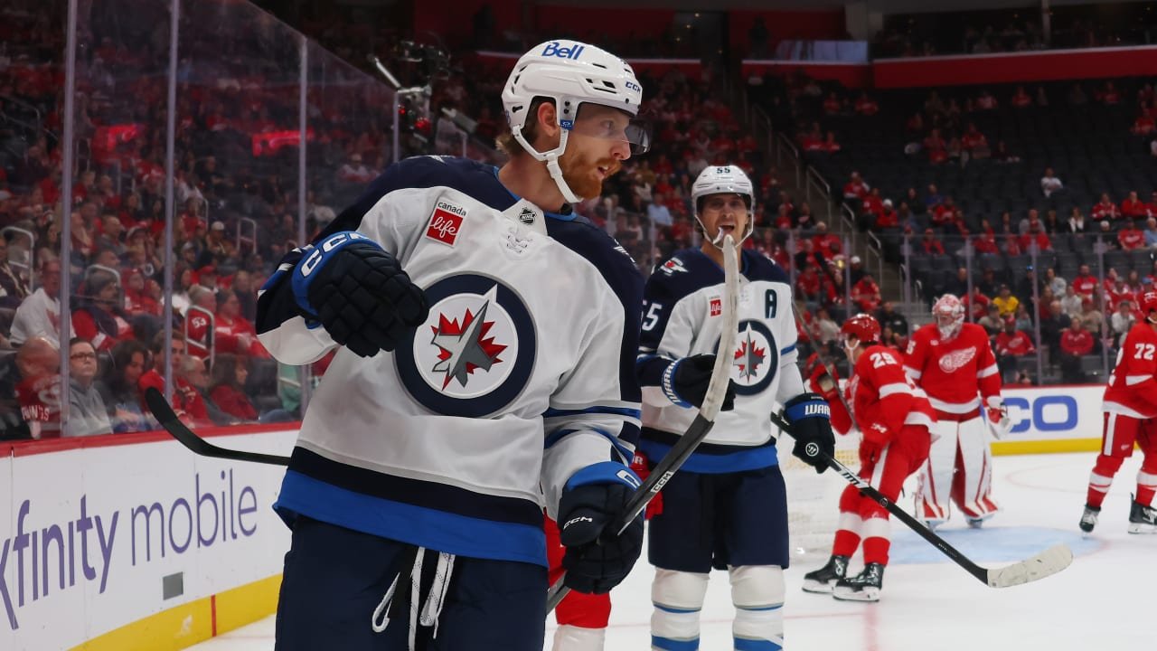 Kyle Connor celebrates with Mark Scheifele during Winnipeg’s game against Detroit at Little Caesars Arena on October 4, 2026.