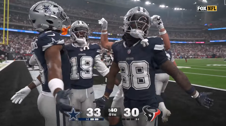 CeeDee Lamb, number 88, celebrates his late touchdown against the Houston Texans with Cowboys teammates.