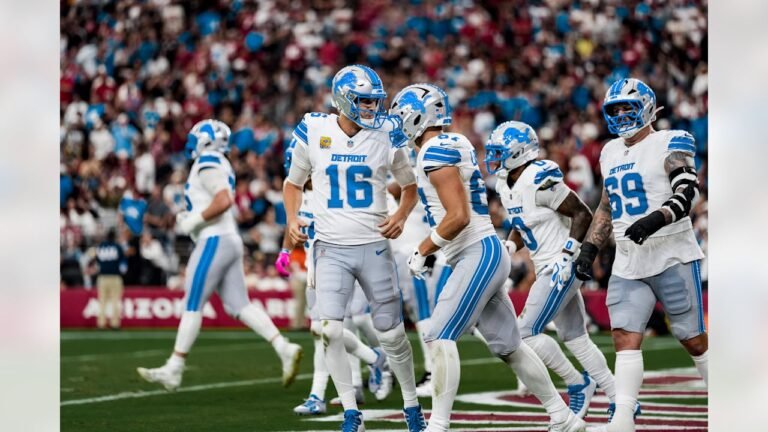 Jared Goff and Sam LaPorta celebrate a Detroit touchdown in white and blue uniforms against Arizona on October 11, 2026.