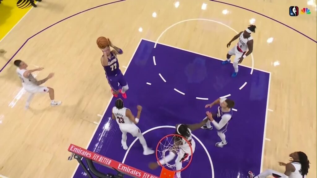 Luka Dončić shoots near the rim against Portland defenders during the Lakers’ October 27 game.
