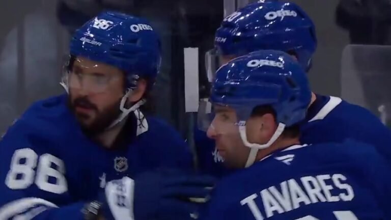 Kirill Marchenko in Toronto’s blue No. 86 jersey beside John Tavares after scoring against Buffalo.