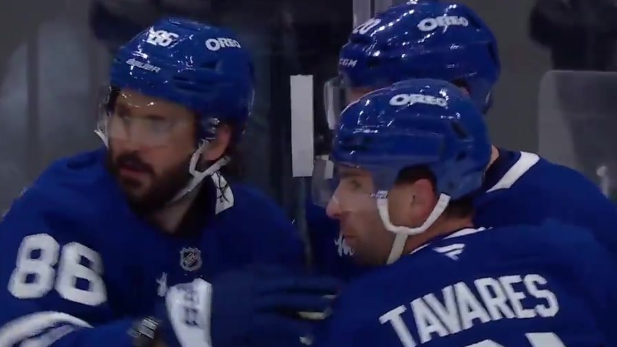 Kirill Marchenko in Toronto’s blue No. 86 jersey beside John Tavares after scoring against Buffalo.