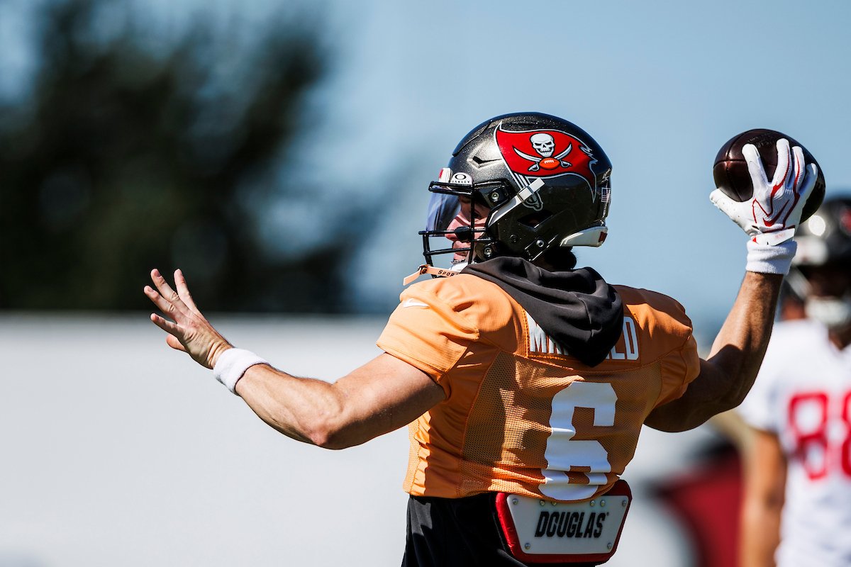 Baker Mayfield prepares to throw at Buccaneers practice with a glove on his right hand.