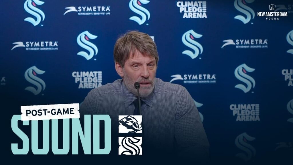 Seattle Kraken coach Lane Lambert at the postgame podium following the October 22, 2026 win over Utah. Official club video thumbnail.