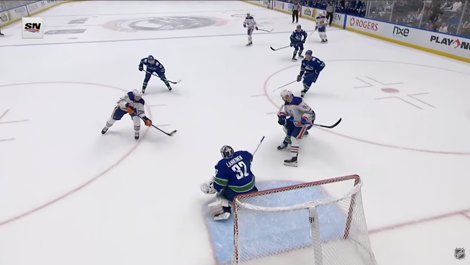 Ryan Shea shoots toward Vancouver goalie Kevin Lankinen through an open lane after Connor McDavid’s pass.
