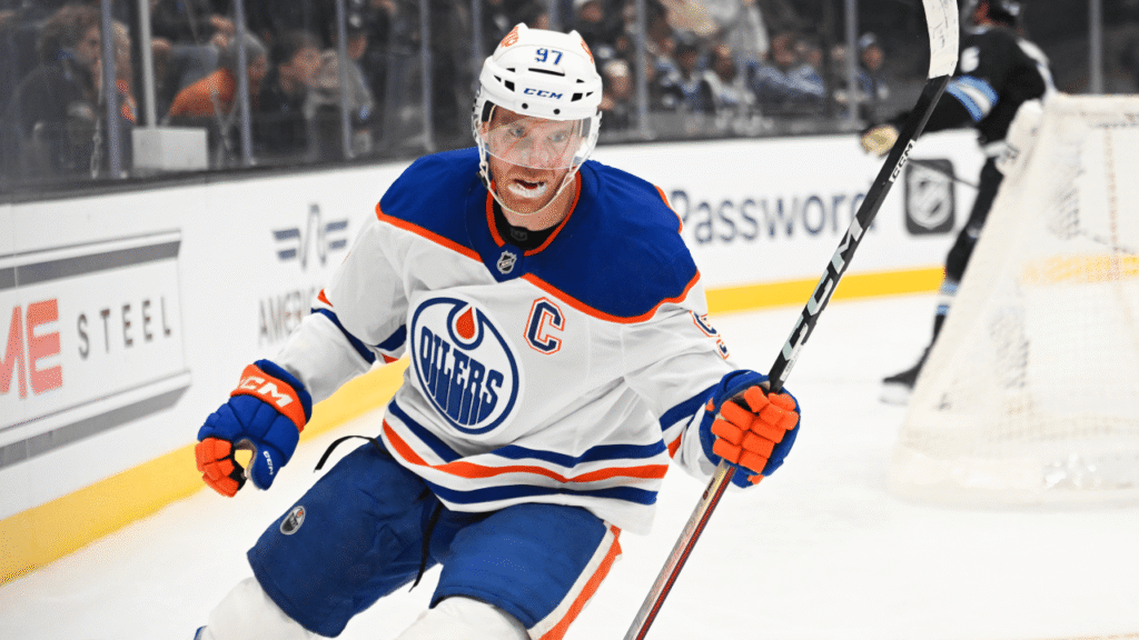 Connor McDavid skates near the boards during Edmonton’s game against Utah.