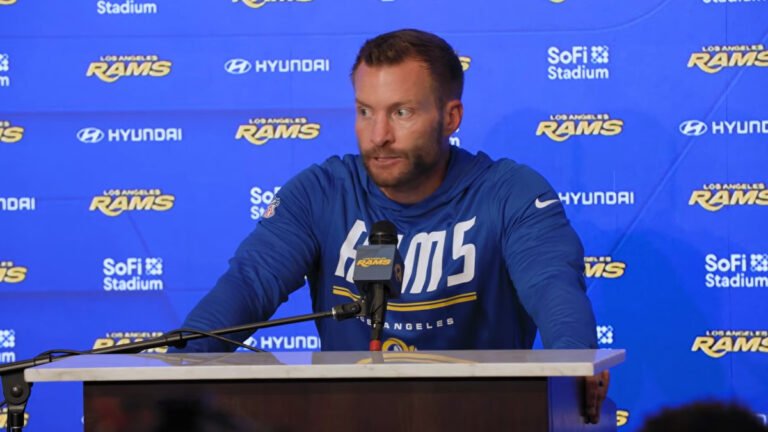 Sean McVay in a blue Rams hoodie speaks at a postgame press conference.