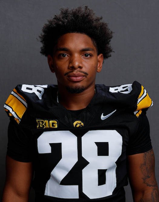Kamari Moulton wearing Iowa’s black number 28 jersey.
