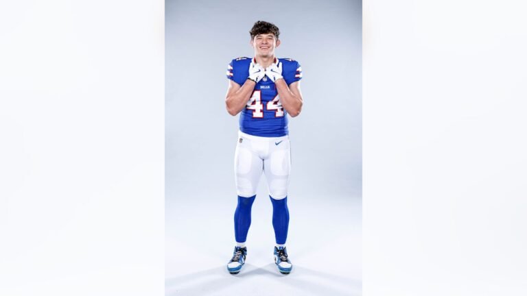 Joe Andreessen smiles in his blue Buffalo Bills No. 44 uniform at media day.