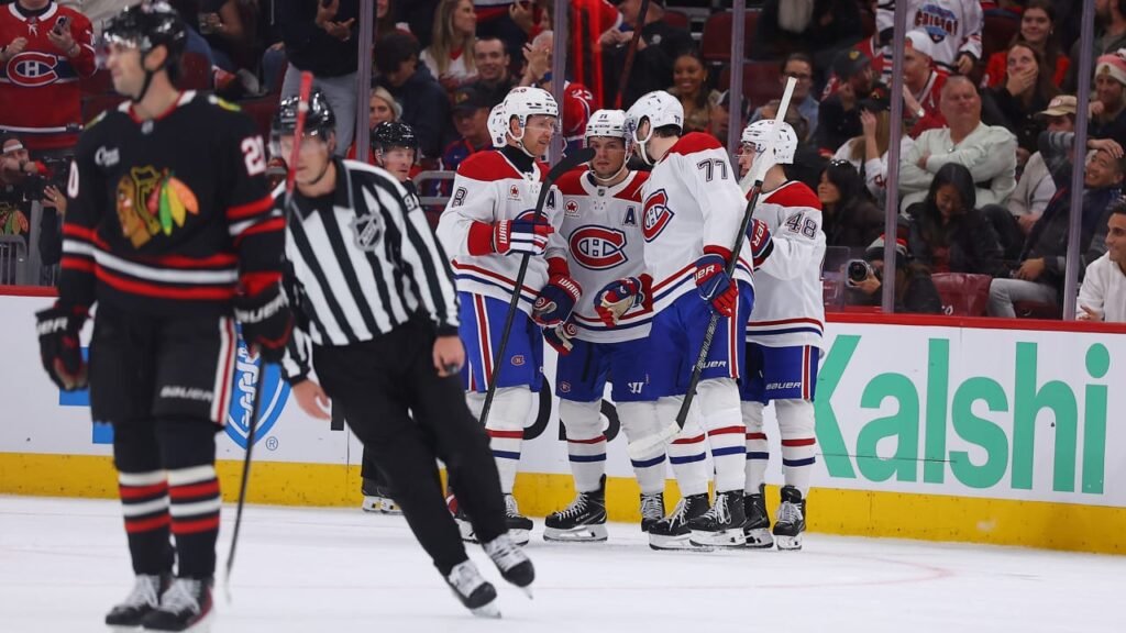 Canadiens players celebrate on the ice during their game against the Blackhawks at United Center.