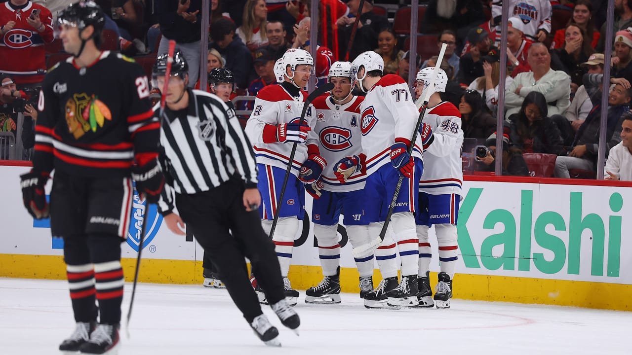 Canadiens players celebrate on the ice during their game against the Blackhawks at United Center.
