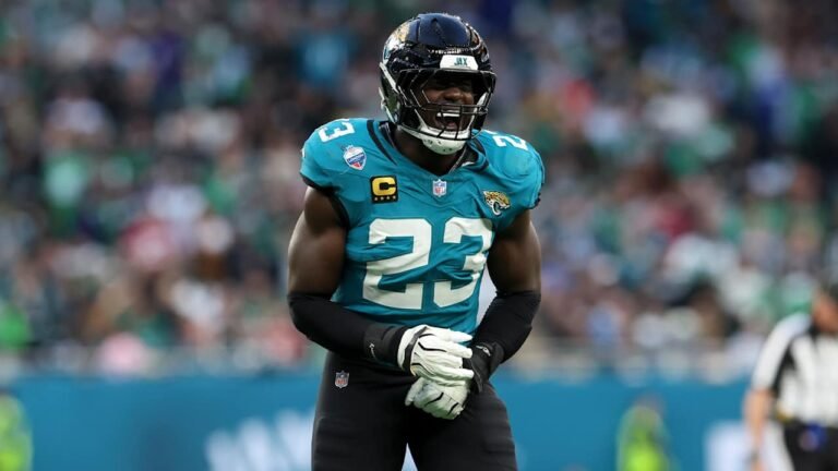 Jaguars linebacker Foyesade Oluokun wearing a teal jersey and black helmet.