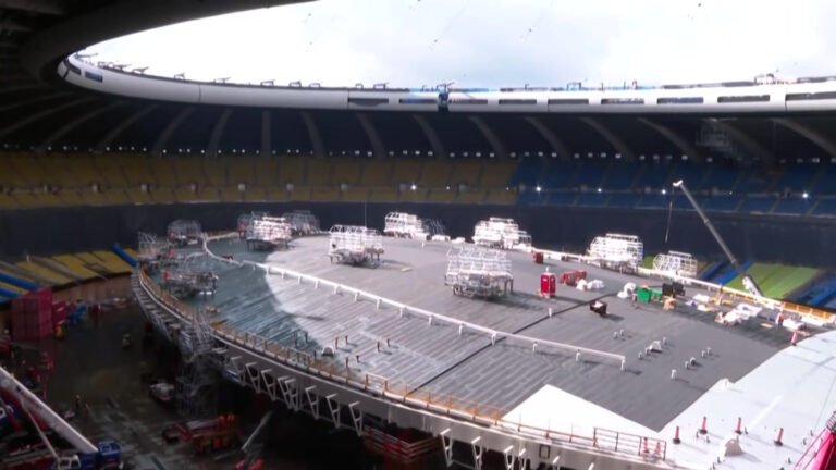Construction crews work around the assembled replacement roof inside Montreal&rsquo;s Olympic Stadium.