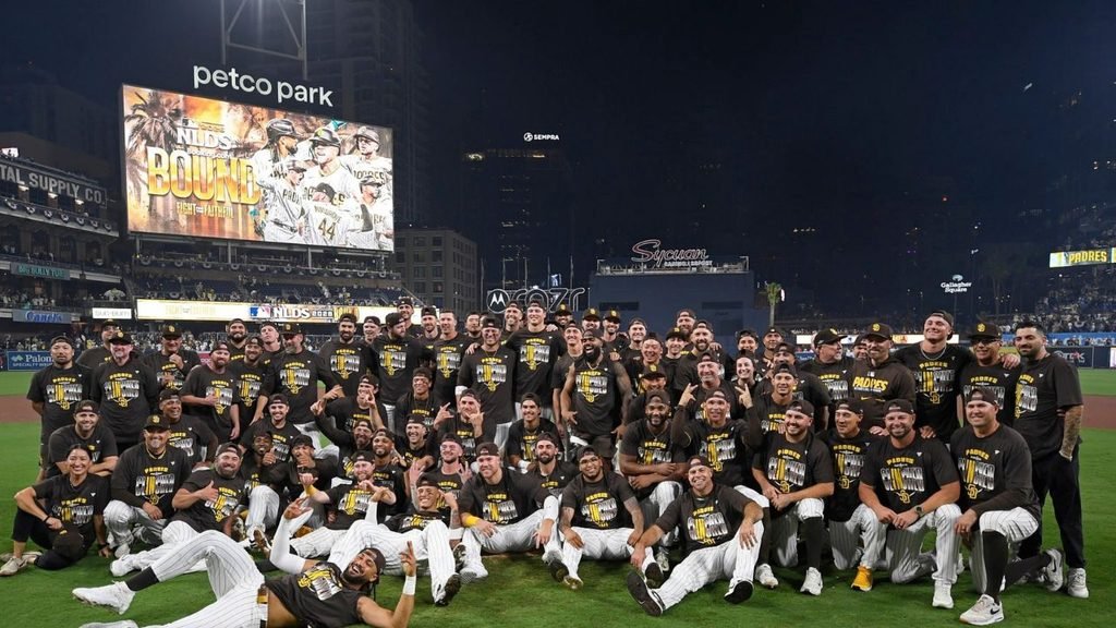 Padres players and staff pose on the field at Petco Park after eliminating the Cubs on September 30, 2026.