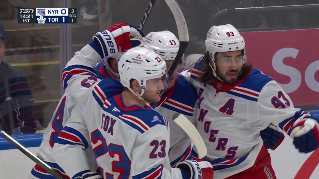 Mika Zibanejad, number 93, celebrates with Rangers teammates in Toronto in a TSN broadcast still.