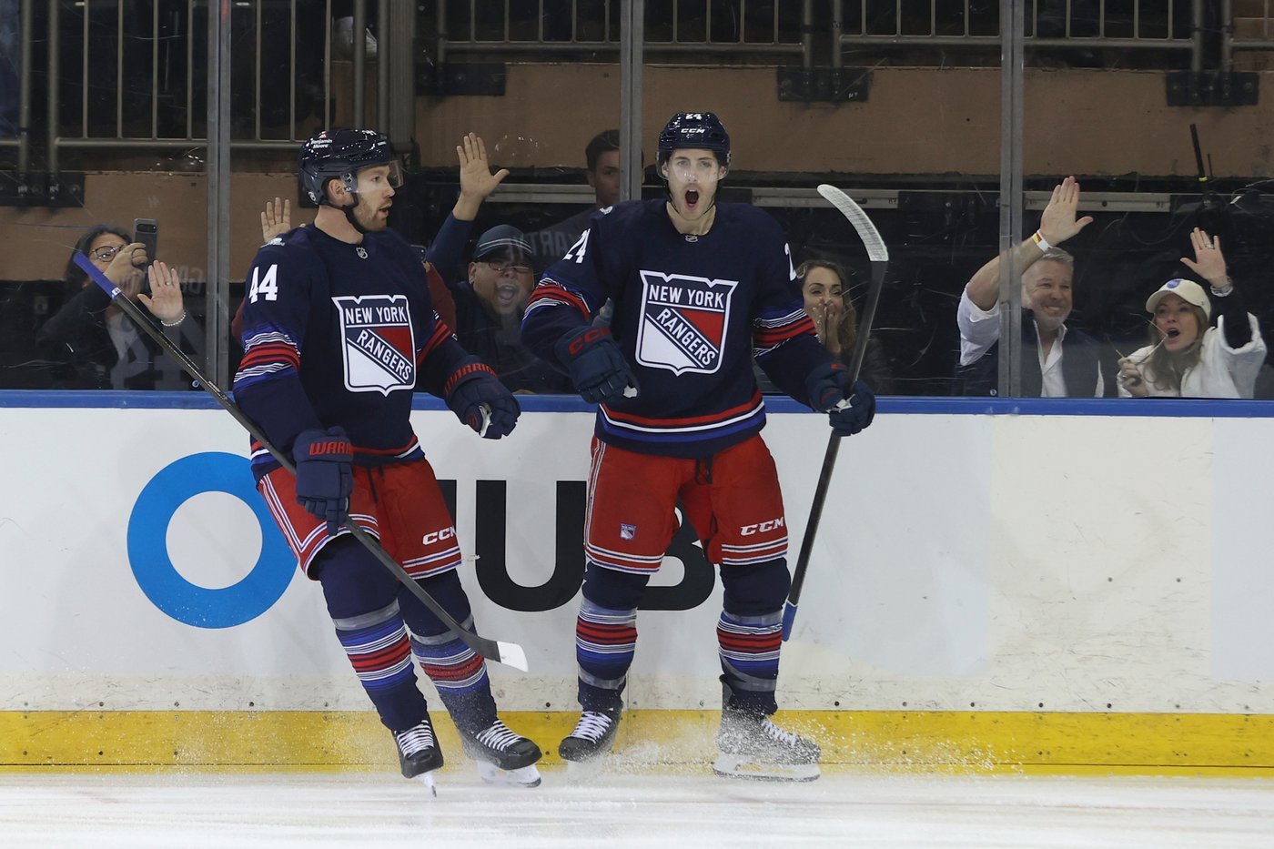 Vladislav Gavrikov and Tye Kartye celebrate a New York Rangers goal against Vancouver on October 11, 2026.