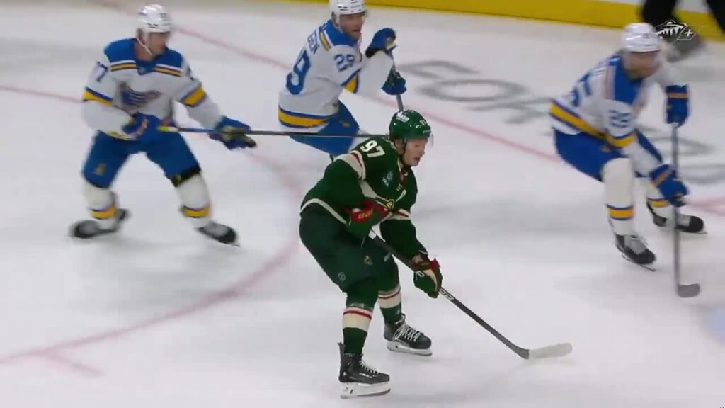 Kirill Kaprizov handles the puck between St. Louis defenders during Minnesota’s win.