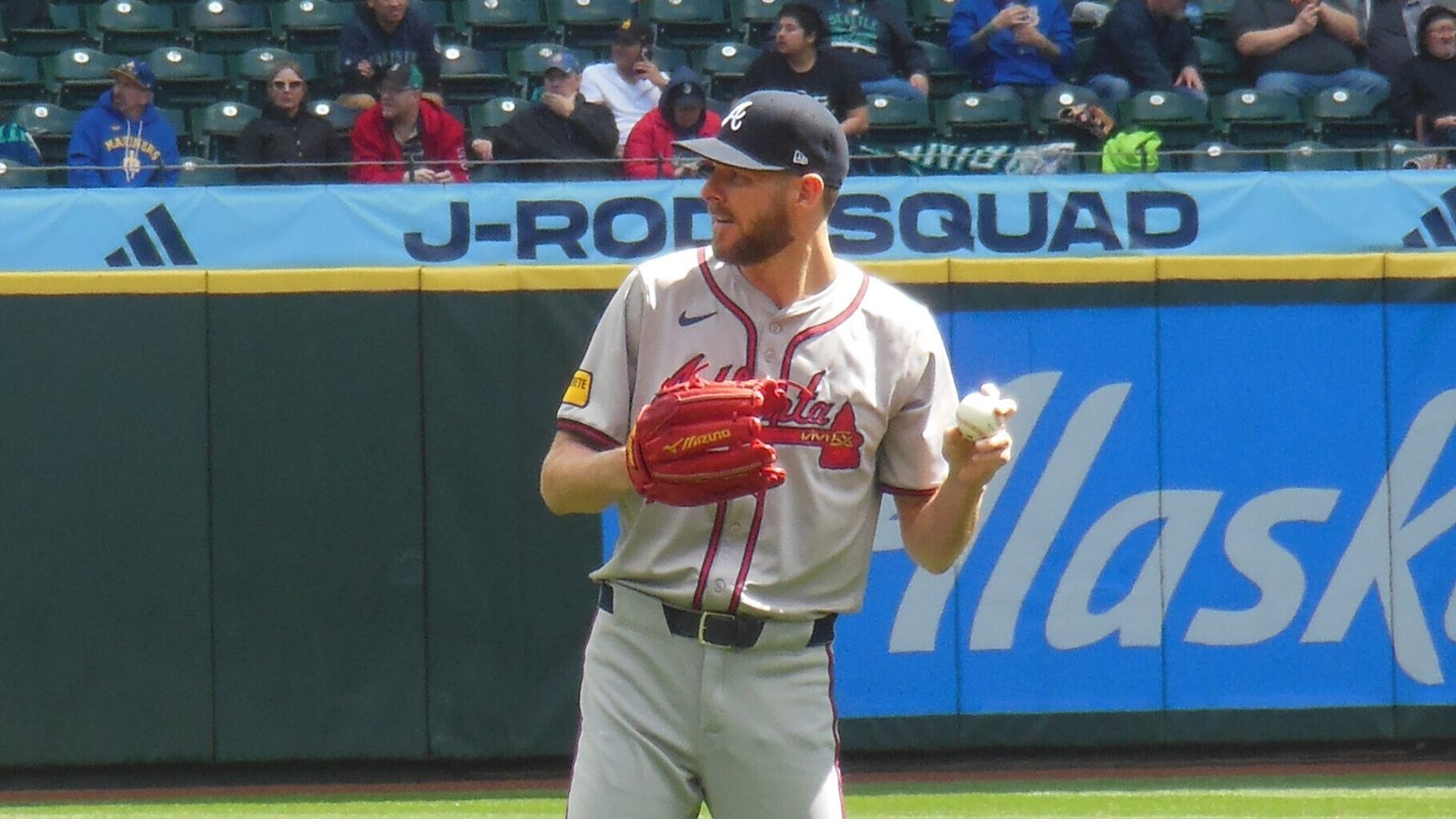 Chris Sale holds a baseball and glove while warming up for Atlanta in Seattle on May 1, 2024.